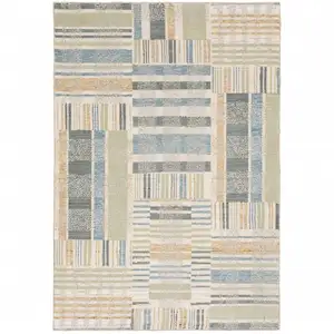 Photo of Green Grey And Ivory Geometric Power Loom Stain Resistant Area Rug