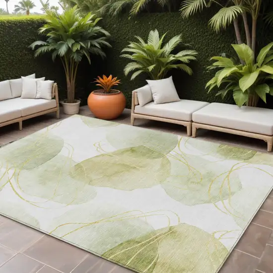 Green and Ivory Abstract Washable Non Skid Indoor Outdoor Area Rug Photo 1