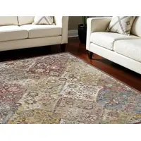 Photo of Green and Ivory Floral Distressed Area Rug