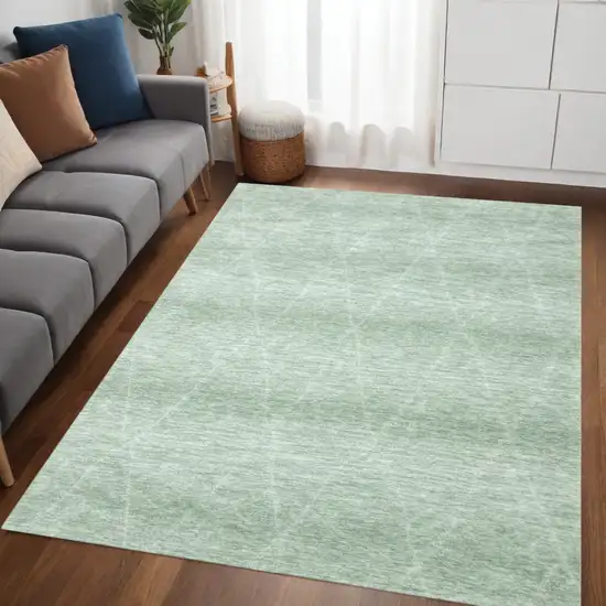 Green and Ivory Geometric Power Loom Distressed Area Rug Photo 1