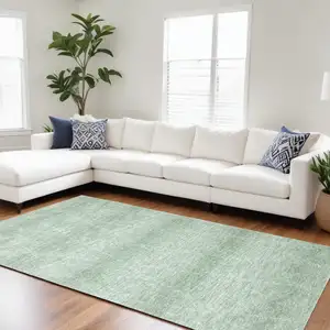 Photo of Green and Ivory Geometric Power Loom Distressed Area Rug