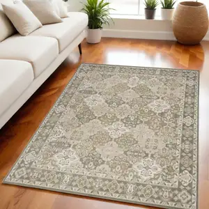 Photo of Green and Ivory Medallion Power Loom Distressed Area Rug