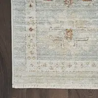 Photo of Green and Ivory Oriental Power Loom Distressed Area Rug With Fringe