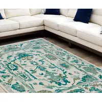 Photo of Green and Ivory Wool Floral Hand Knotted Area Rug With Fringe