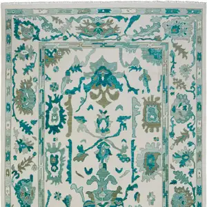 Photo of Green and Ivory Wool Floral Hand Knotted Area Rug With Fringe