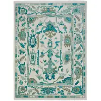 Photo of Green and Ivory Wool Floral Hand Knotted Area Rug With Fringe