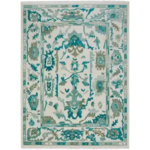 Photo of Green and Ivory Wool Floral Hand Knotted Area Rug With Fringe