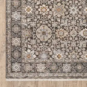 Photo of Grey And Ivory Oriental Power Loom Stain Resistant Area Rug With Fringe