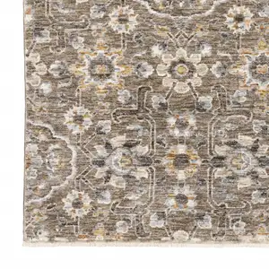 Photo of Grey And Tan Floral Power Loom Stain Resistant Area Rug With Fringe