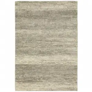 Photo of Grey Beige And Tan Abstract Power Loom Stain Resistant Area Rug