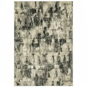 Photo of Grey Beige Charcoal And Blue Abstract Power Loom Stain Resistant Area Rug