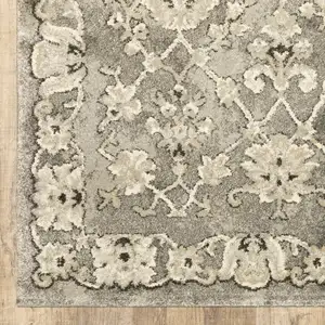 Photo of Grey Beige Tan And Brown Oriental Power Loom Stain Resistant Area Rug