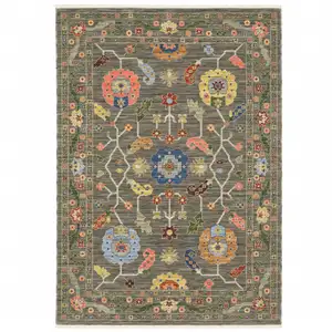 Photo of Grey Blue Pink Orange Rust Red Green And Ivory Oriental Power Loom Stain Resistant Area Rug With Fringe