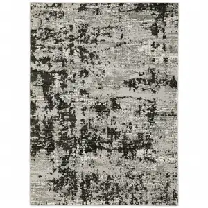 Photo of Grey Charcoal Black And Ivory Abstract Power Loom Stain Resistant Area Rug