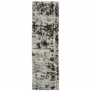 Photo of Grey Charcoal Black And Ivory Abstract Power Loom Stain Resistant Runner Rug