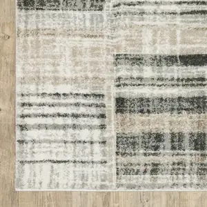 Photo of Grey Charcoal Ivory Tan Brown And Beige Geometric Power Loom Stain Resistant Area Rug