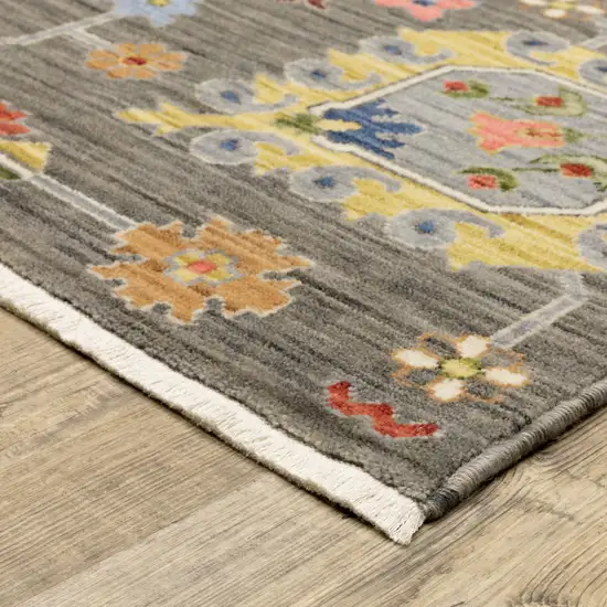 Grey Charcoal Yellow Blue Rust Red Pink Green And Ivory Oriental Power Loom Stain Resistant Area Rug With Fringe Photo 4