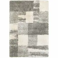 Photo of Grey Ivory And Silver Geometric Shag Power Loom Stain Resistant Area Rug