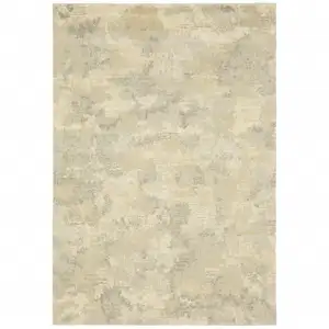 Photo of Grey Ivory Beige And Taupe Abstract Power Loom Stain Resistant Area Rug