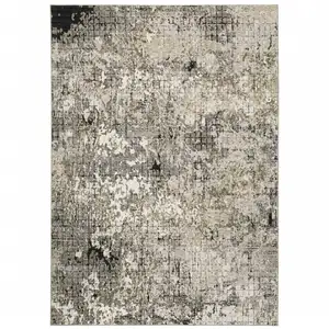 Photo of Grey Ivory Beige Charcoal Black Tan And Brown Abstract Power Loom Stain Resistant Area Rug