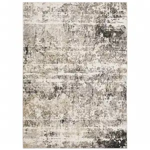 Photo of Grey Ivory Beige Charcoal Black Tan And Brown Abstract Power Loom Stain Resistant Area Rug