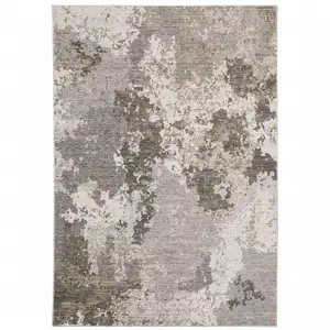 Photo of Grey Ivory Beige Tan Brown And Black Abstract Power Loom Stain Resistant Area Rug