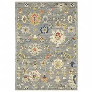 Photo of Grey Ivory Gold Salmon Red Blue And Green Oriental Power Loom Stain Resistant Area Rug With Fringe