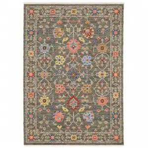 Photo of Grey Salmon Pink Gold Blue Rust Deep Blue Ivory And Green Oriental Power Loom Stain Resistant Area Rug With Fringe