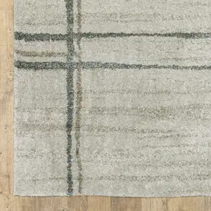 Photo of Grey Teal Beige And Tan Geometric Power Loom Area Rug