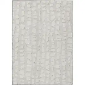 Photo of Ivory And Beige Abstract Washable Indoor Outdoor Area Rug