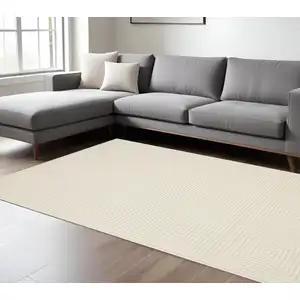 Photo of Ivory And Beige Geometric Area Rug