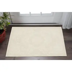 Photo of Ivory And Beige Medallion Area Rug