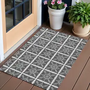 Photo of Ivory And Black Medallion Washable Indoor Outdoor Area Rug