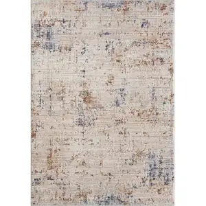 Photo of Ivory And Blue Abstract Area Rug