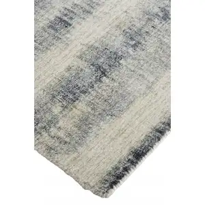 Photo of Ivory And Blue Abstract Hand Woven Area Rug