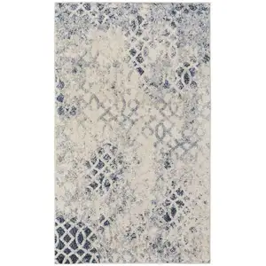 Photo of Ivory And Blue Abstract Power Loom Distressed Area Rug