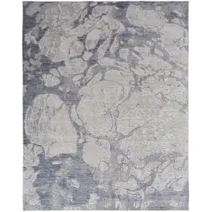 Photo of Ivory And Blue Abstract Power Loom Distressed Area Rug