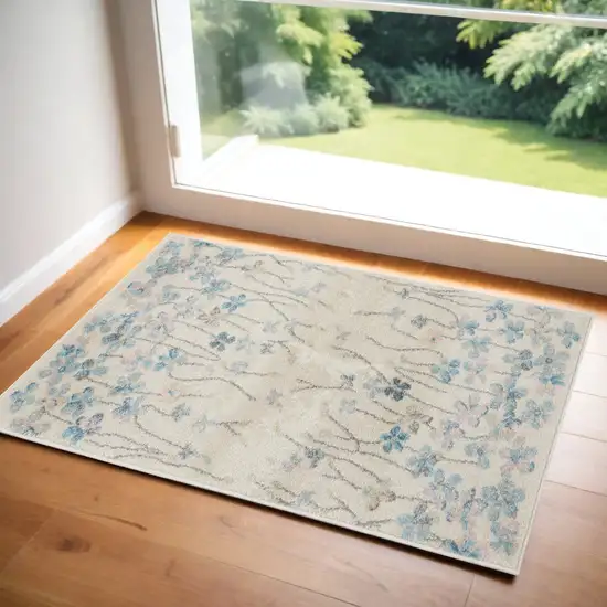 Ivory And Blue Floral Area Rug Photo 1