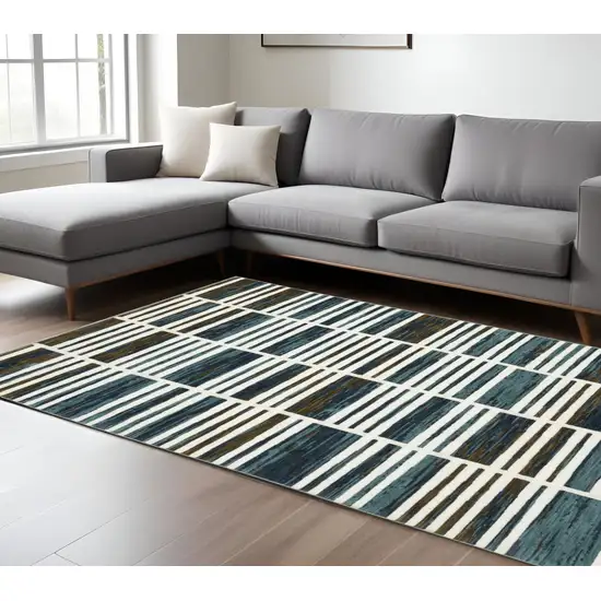 Ivory And Blue Geometric Area Rug Photo 1