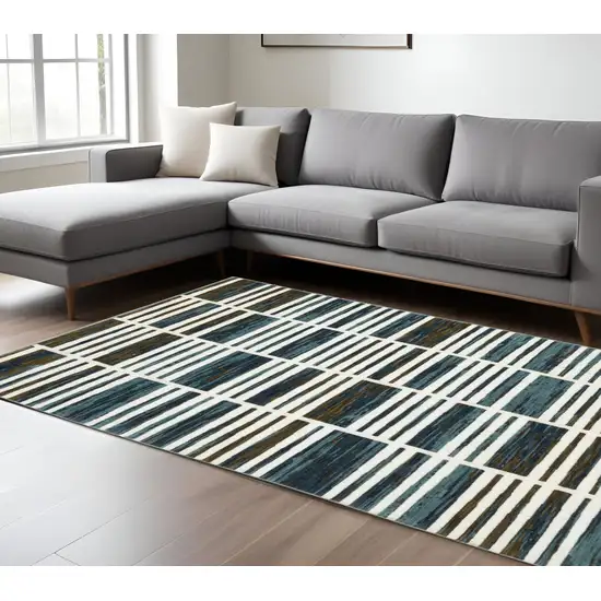 Ivory And Blue Geometric Area Rug Photo 1