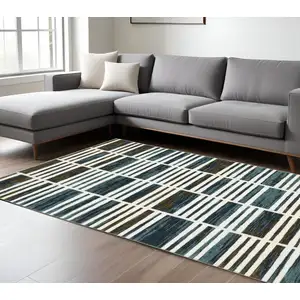 Photo of Ivory And Blue Geometric Area Rug