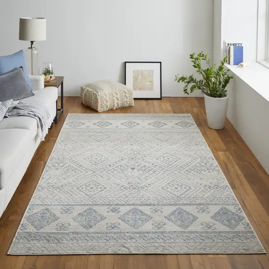 Ivory And Blue Geometric Power Loom Distressed Area Rug Photo 7