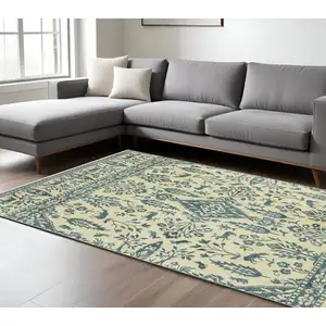 Photo of Ivory And Blue Oriental Area Rug With Fringe