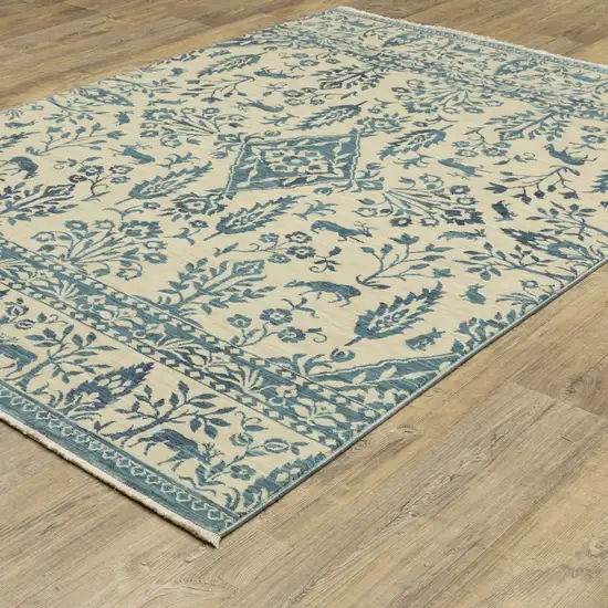 Ivory And Blue Oriental Area Rug With Fringe Photo 4