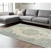 Photo of Ivory And Blue Oriental Distressed Area Rug