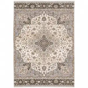 Photo of Ivory And Blue Oriental Power Loom Stain Resistant Area Rug With Fringe