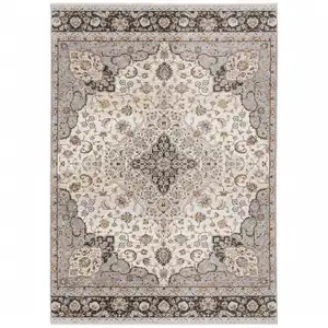 Photo of Ivory And Blue Oriental Power Loom Stain Resistant Area Rug With Fringe