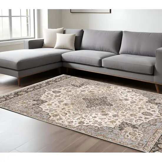 Ivory and Blue Oriental Power Loom Area Rug With Fringe Photo 1