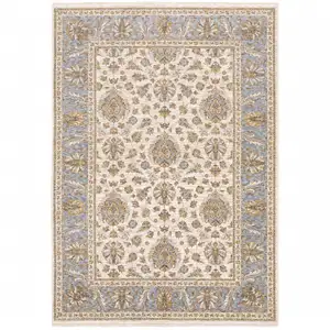 Photo of Ivory And Blue Oriental Power Loom Stain Resistant Area Rug With Fringe