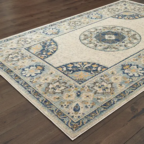 Ivory And Blue Oriental Power Loom Stain Resistant Area Rug Photo 4